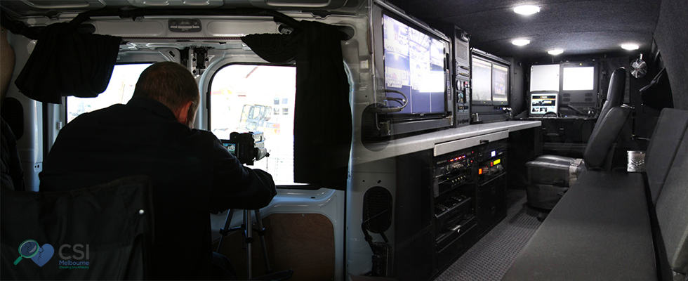 An image of surveillance investigator hiding in a van while observing inside to know what his targets doing.